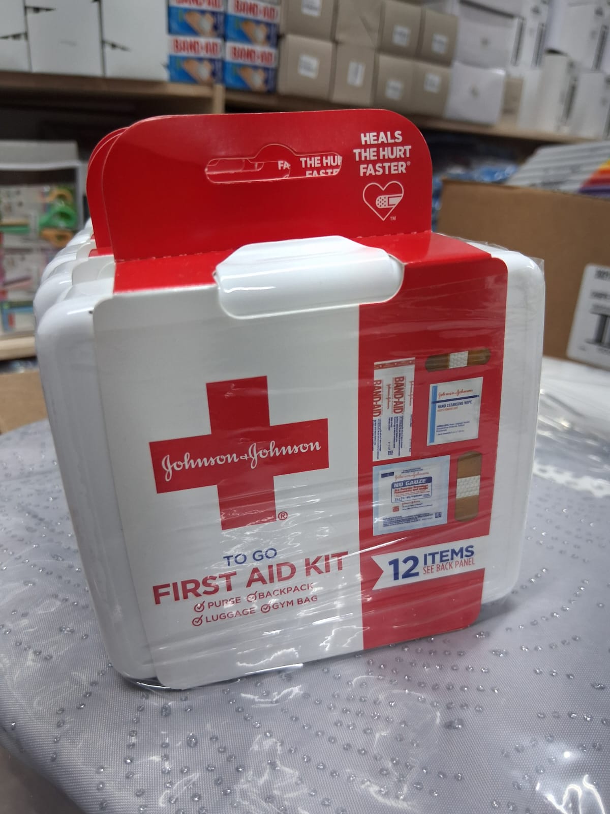 Johnson First Aid Kit Contains 2 Cleansing wipes, 4 Gauze pads, 2 Baind-Aid 3/4, 4 Band-Aid 5/8 - Case of 12